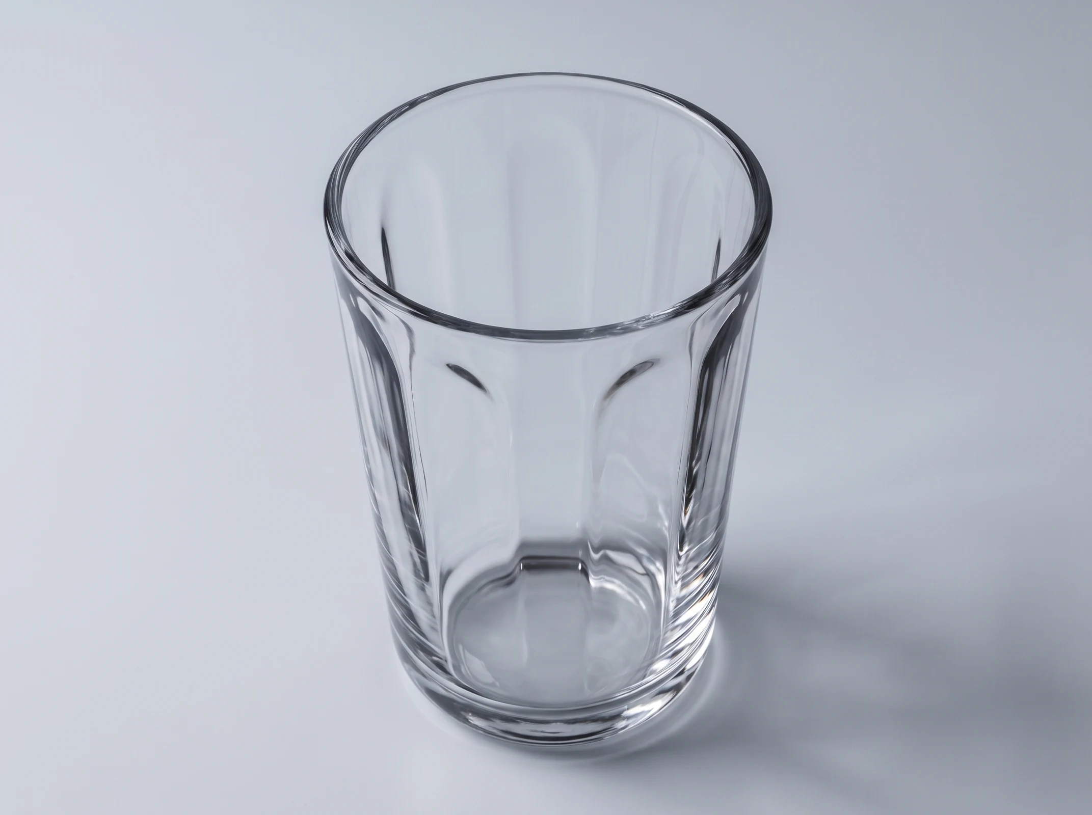Concept close-up showing the rim, fluting and transparent form of a tumbler