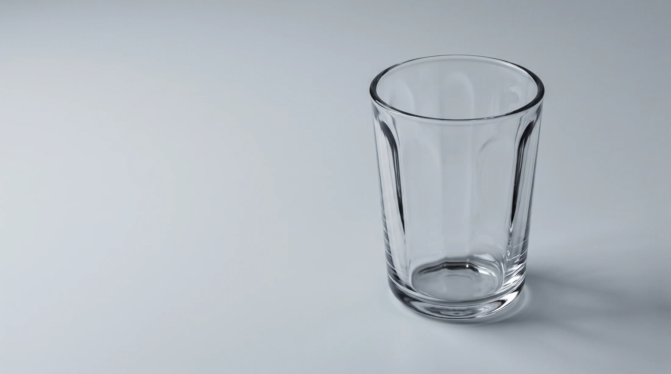 Concept visualisation of transparent, vertically fluted tumbler forms in soft studio light